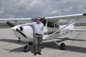 Chief Flight Instructor John Maxwell with the Cessna 172.